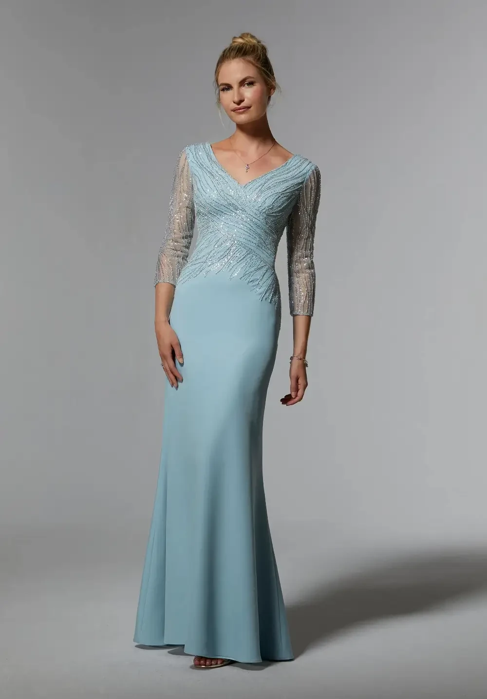 model is wearing a light blue mothers dress