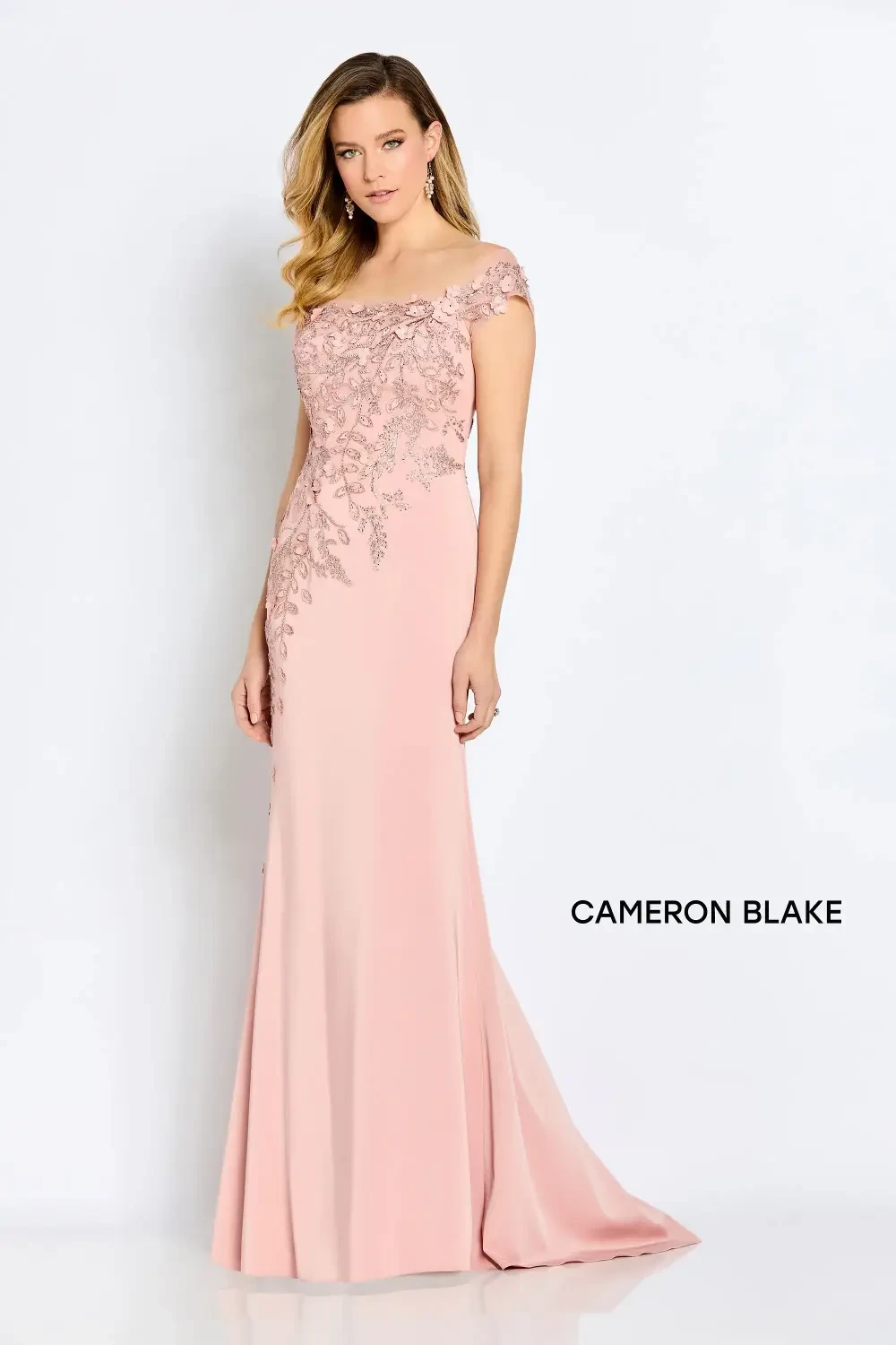 model is wearing a pastel pink mothers gown